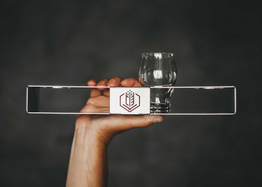 Metal flight holder with laser cut logo