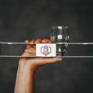Metal flight holder with laser cut logo