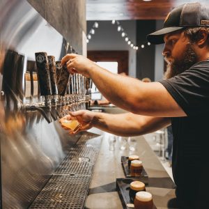 Premium craft beer being poured from the tap