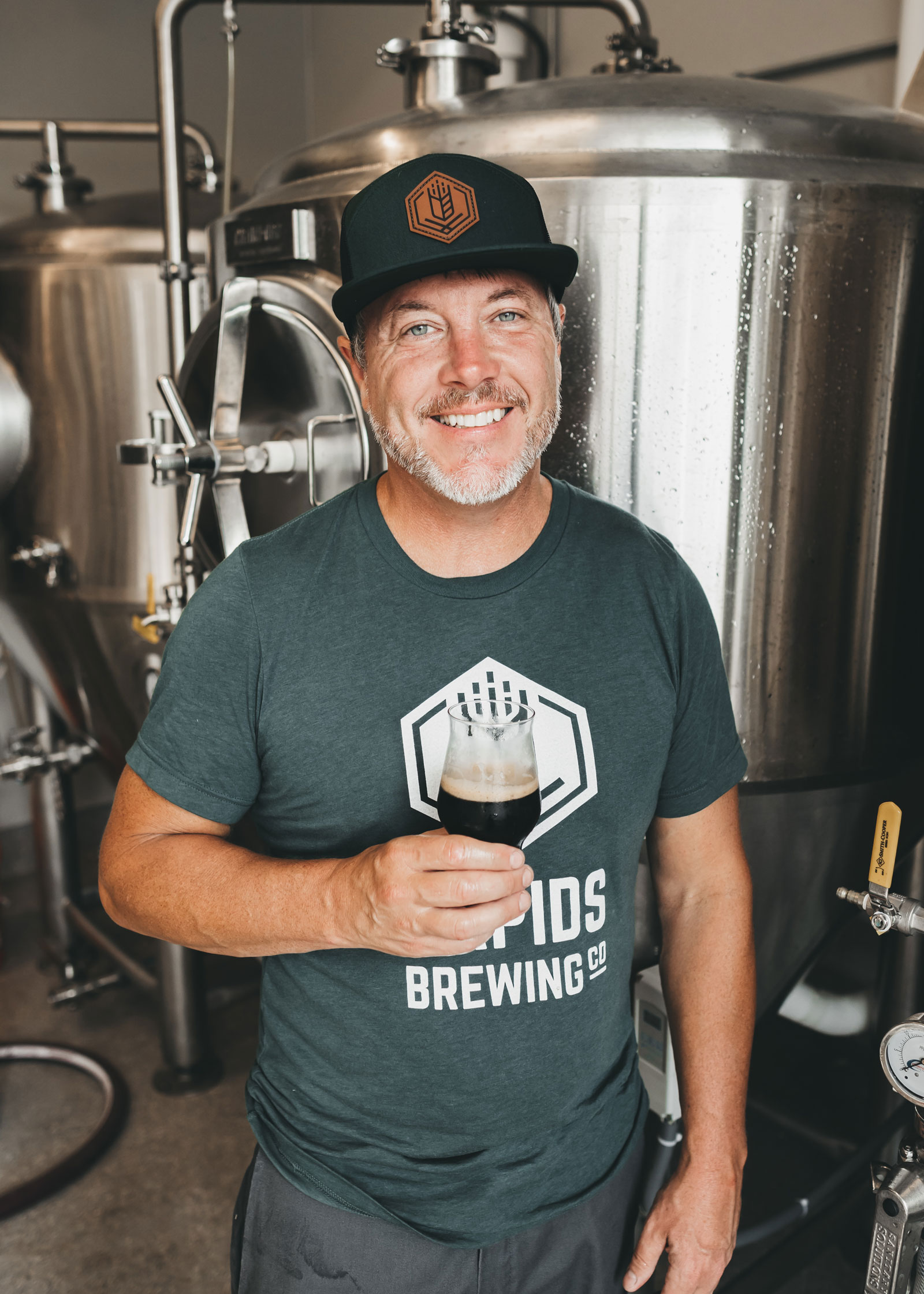 Head brewer Darin Jensen smiling