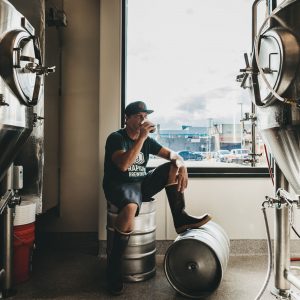 Head Brewer Darin Jensen drinking brown ale