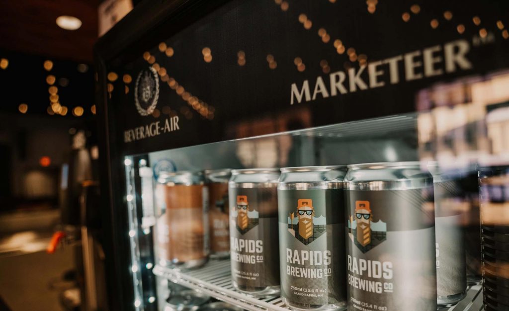 Cans of beer crowlers in cooler